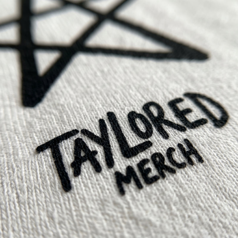 Direct-to-garment print detail on a Taylored Merch tee