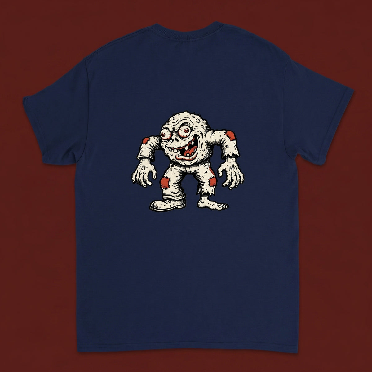 Creep — Taylored Merch streetwear tee, oxblood studio flat-lay, navy back print
