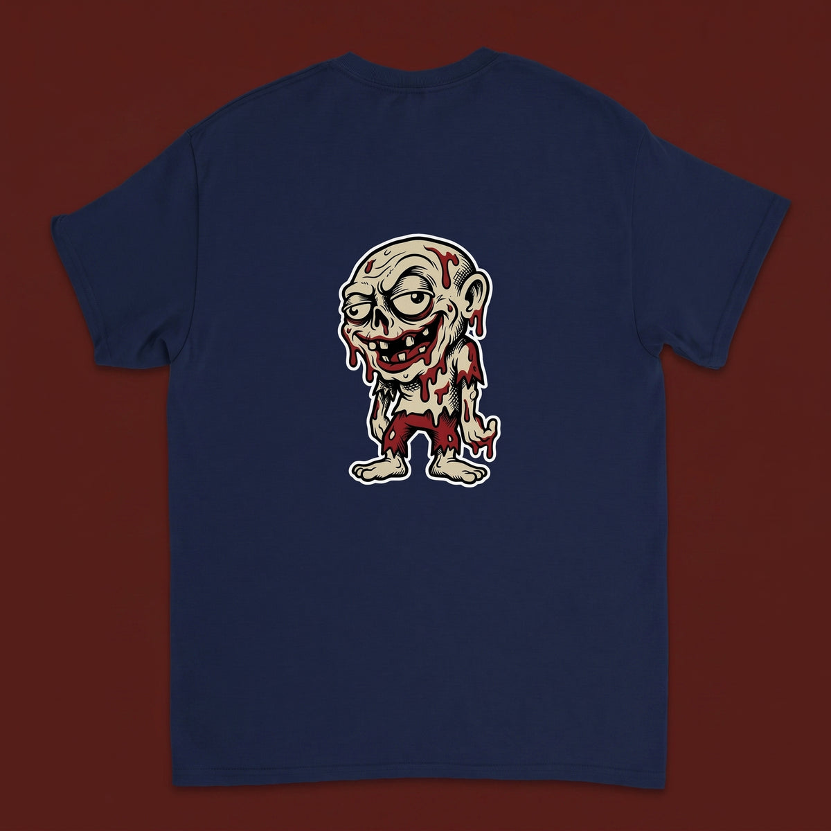 Ghoul — Taylored Merch streetwear tee, oxblood studio flat-lay, navy back print