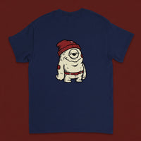 One Eye — Taylored Merch streetwear tee, oxblood studio flat-lay, navy back print