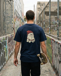 One Eye — Taylored Merch streetwear tee, navy, worn back view street scene