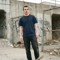 One Eye — Taylored Merch streetwear tee, navy, front fit on model