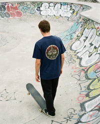 Overgrown — Taylored Merch streetwear tee, navy, back print on model
