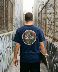 Overgrown — Taylored Merch streetwear tee, navy, worn back view street scene