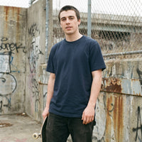 Overgrown — Taylored Merch streetwear tee, navy, front fit on model