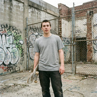 Warp streetwear tee, front fit on model